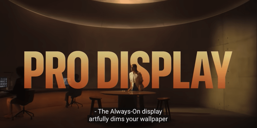 Apple ad with "Pro Display" across the screen in orange, behind a woman leaning on a table
